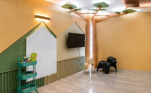 Sensory and movement area with a tree-shaped ceiling feature and open floor space.